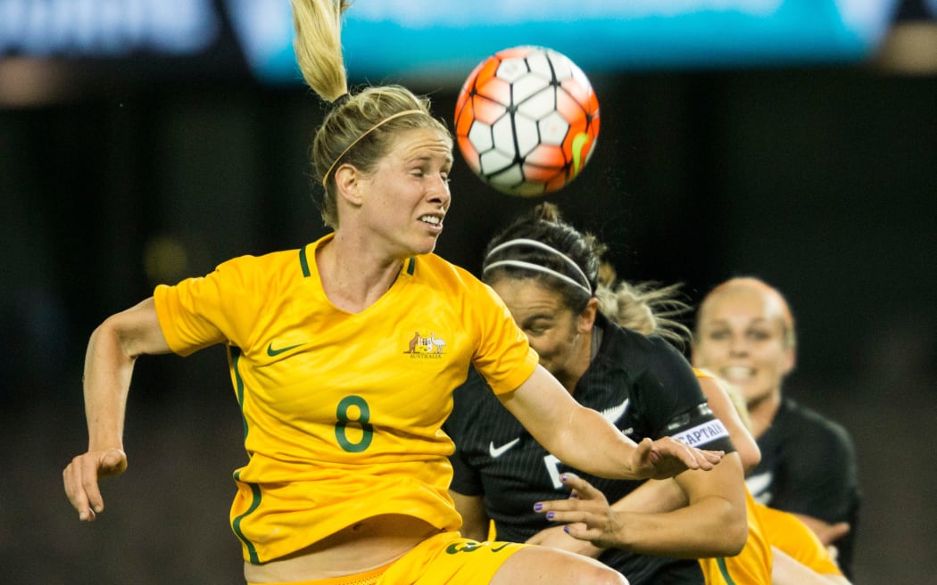Australian Matildas player Elise Kellond-Knight goes up to head the ball against New Zealand.