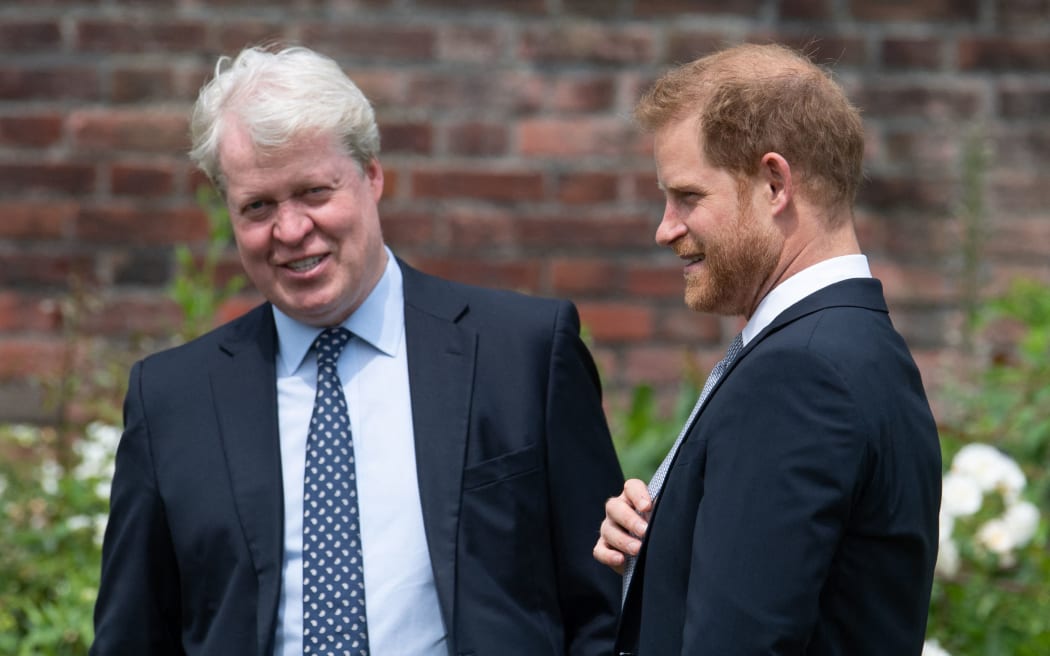 Prince Harry, Duke of Sussex (right) chats with his uncle Earl Spencer the unveiling of a statue of their mother, Princess Diana at The Sunken Garden in Kensington Palace, London on July 1, 2021, which would have been her 60th birthday.