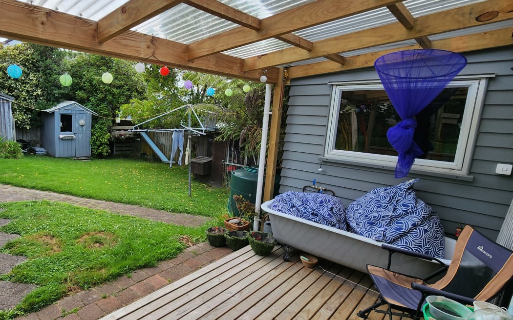 Gary listens from his backyard.