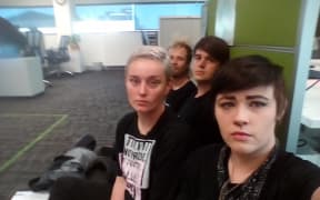 Four protesters were arrested after chaining themselves together at the Corrections office in Hamilton.