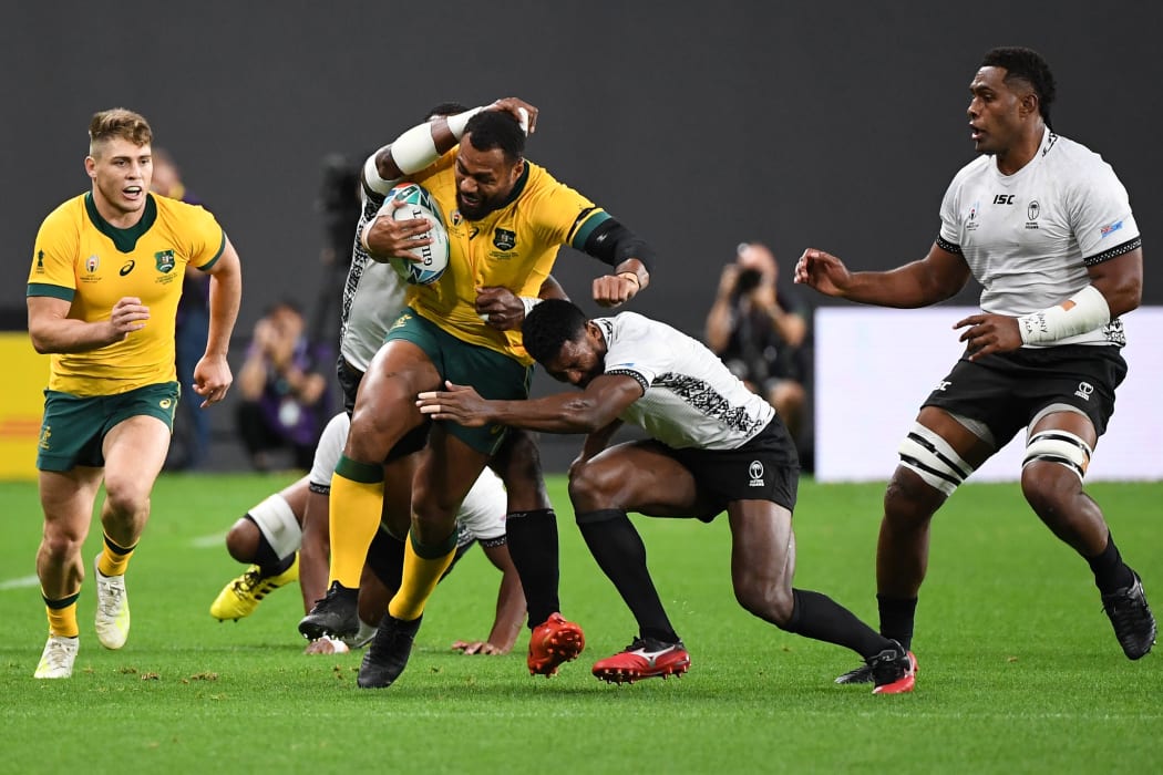 Fiji's scrum-half Frank Lomani tackles Australia's centre Samu Kerevi during the match between Australia and Fiji.