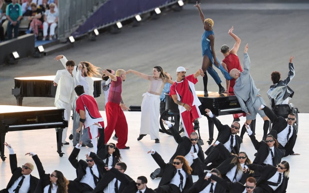 Dancers perform during the Paris 2024 Paralympic Games Opening Ceremony at the Place de la Concorde in Paris on August 28, 2024. (Photo by Bertrand GUAY / AFP)