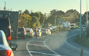 A line of cars on State Highway 1 after a fuel tanker flips south of Levin.