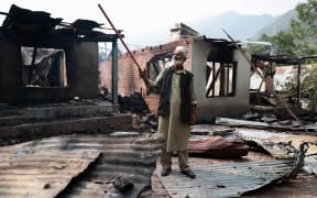 Lal Din, 72, shows the location from which the mortar shell comes and hits Sultan Mohammad Naik's house in Kamalkote, Uri, Jammu and Kashmir, India, on May 7, 2025. Many civilians are injured on the Indian side after their house is hit by Pakistani shelling in Baramulla district. The Indian military says early Wednesday it launches strikes against Pakistan in retaliation for last month's militant attack in Pahalgam, Jammu and Kashmir. (Photo by Nasir Kachroo/NurPhoto) (Photo by Nasir Kachroo / NurPhoto / NurPhoto via AFP)