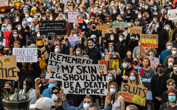 Demonstrators attend a Black Lives Matter protest to express solidarity with US protestors in Sydney on June 6, 2020 and demand an end to frequent Aboriginal deaths in custody in Australia.