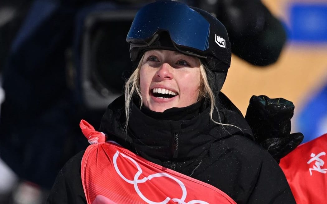 New Zealand's Zoi Sadowski Synnott waits for her score as she competes in the snowboard women's slopestyle final run during the Beijing 2022 Winter Olympic Games at the Genting Snow Park H & S Stadium in Zhangjiakou on February 6, 2022.
