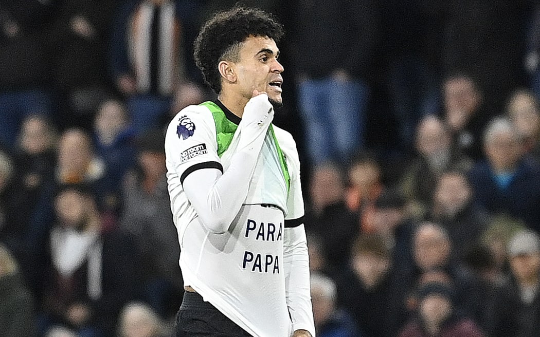 Liverpool's Colombian midfielder Luis Diaz celebrates after scoring the equalising goal during the English Premier League match against Luton Town.