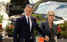 Hunter Biden, son of US President Joe Biden, joined by his wife Melissa Cohen Biden, arrives to the J. Caleb Boggs Federal Building on June 3, 2024 in Wilmington, Delaware. Joe Biden's son Hunter goes on trial June 3, 2024 on gun charges, the first prosecution in US history for the child of a sitting president -- just as the Democratic leader is seeking to accelerate his campaign for reelection.
The 54-year-old denies three felony counts stemming from his purchase of a .38-caliber Colt Cobra revolver in 2018 when, by his own admission, he was heavily addicted to drugs. (Photo by RYAN COLLERD / AFP)