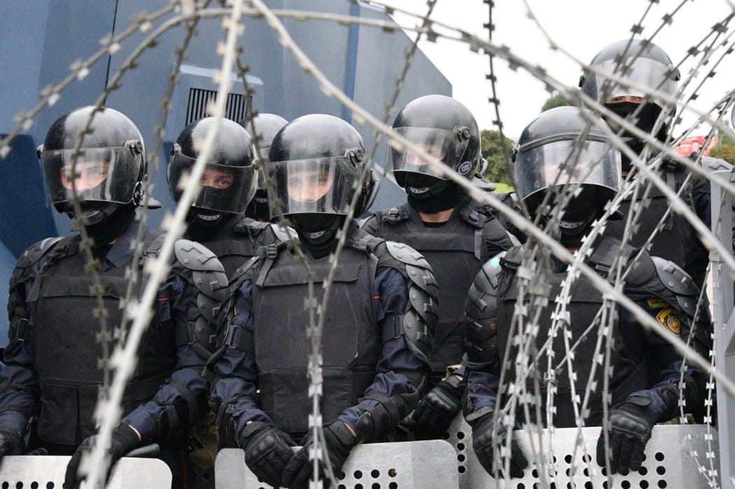 Riot policemen stand guard during demonstration against police violence following recent protests to reject the presidential election results, in Minsk, Belarus.

 Viktor Tolochko / Sputnik