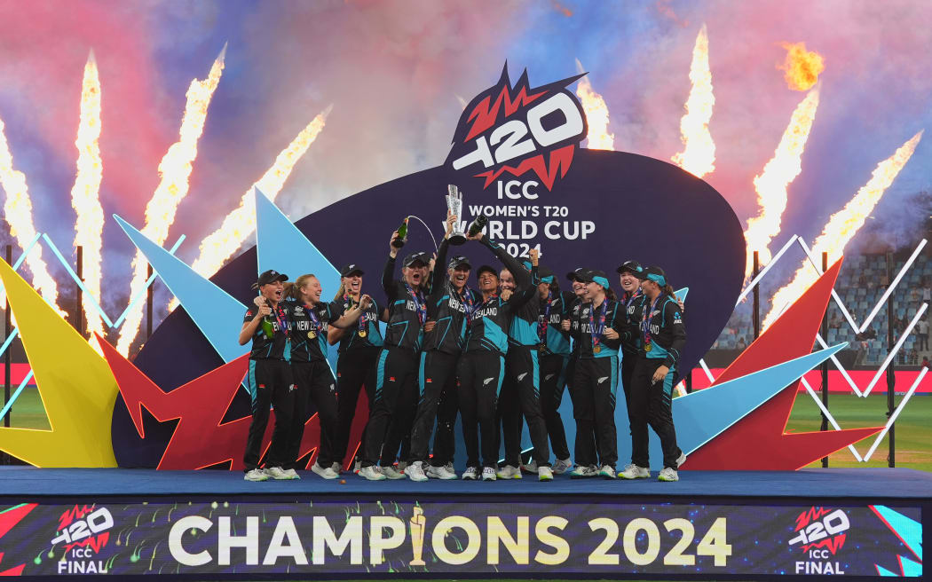 New Zealand White Ferns team celebrates with the trophy, ICC Women's T20 World Cup Final, Dubai, 2024.