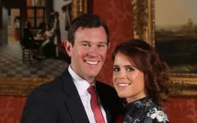Britain's Princess Eugenie of York poses with her fiance Jack Brooksbank at Buckingham Palace after the announcement of their engagement.