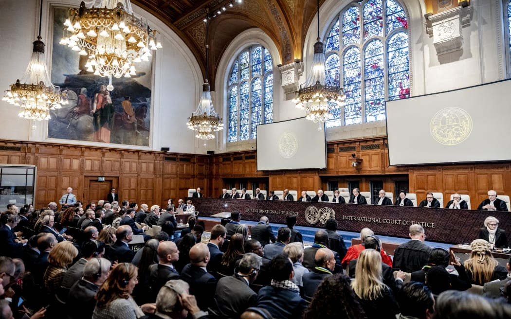 THE HAGUE - President Donoghue and other judges at the International Court of Justice (ICJ) before the hearing of the genocide case against Israel, brought by South Africa. According to the South Africans, Israel is currently committing genocidal acts against Palestinians in the Gaza Strip. ANP REMKO DE WAAL netherlands out - belgium out (Photo by REMKO DE WAAL / ANP MAG / ANP via AFP)