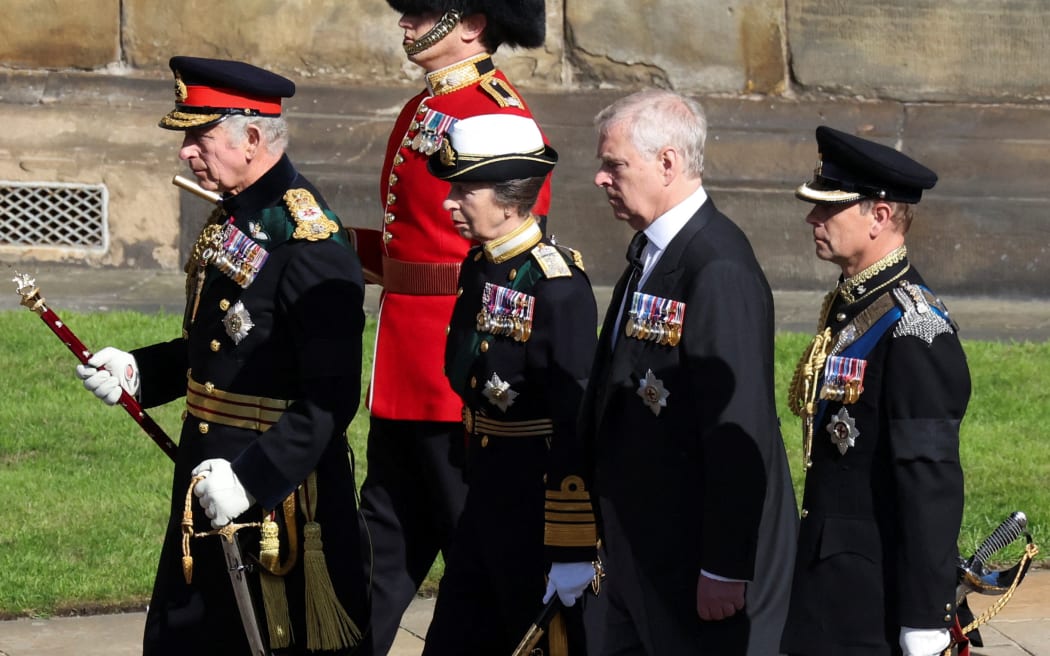 King Charles III,  flanked by Princess Anne, and princes Andrew and Edward, walk behind the procession of Queen Elizabeth II's coffin, from the Palace of Holyroodhouse to St Giles Cathedral, on 12 September 2022.