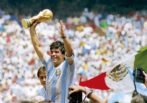 Diego Maradona of Argentina holds the World Cup trophy after defeating West Germany 3-2 during the 1986 FIFA World Cup Final match at the Azteca Stadium on June 29, 1986 in Mexico City, Mexico.