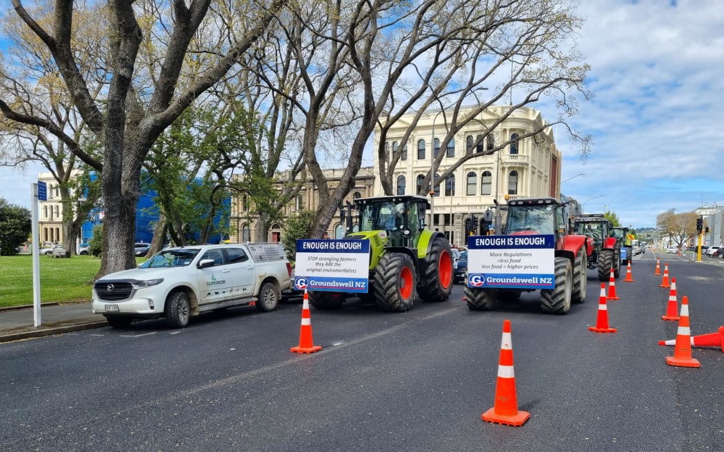About half a dozen tractors arrive in Central Dunedin for the Groundswell protest on 20 October 2022.