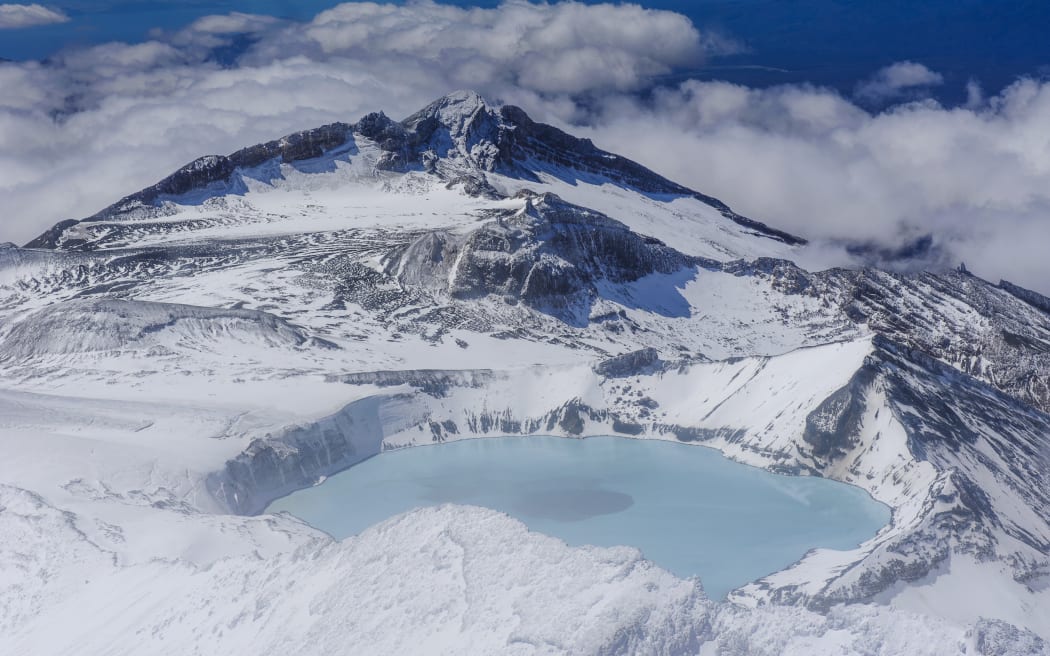 Aerial of a tuquoise crater lake on top of Mount Ruapehu, Tongariro National Park, UNESCO World Heritage Site, North Island, New Zealand, Pacific