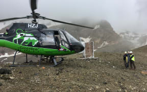 Rescuers helped the woman to a rescue helicopter at first light