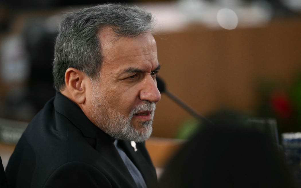 Iran's Foreign Minister Abbas Araghchi gestures during the first plenary session of the BRICS summit in Rio de Janeiro, Brazil, on July 6, 2025. BRICS leaders meeting in Rio de Janeiro on Sunday are expected to decry US President Donald Trump's "indiscriminate" trade tariffs, saying they are illegal and risk hurting the global economy.
