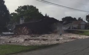A house collapsing into a sinkhole in Florida.