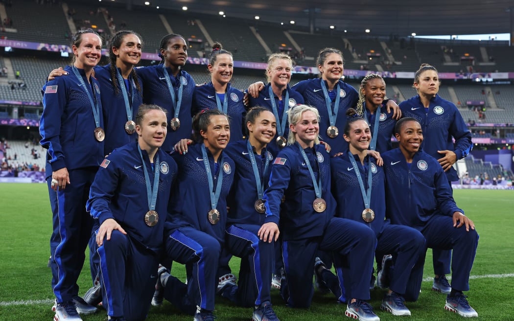 Bronze medalists of Team United States pose after the Women's Rugby Sevens medal ceremony.