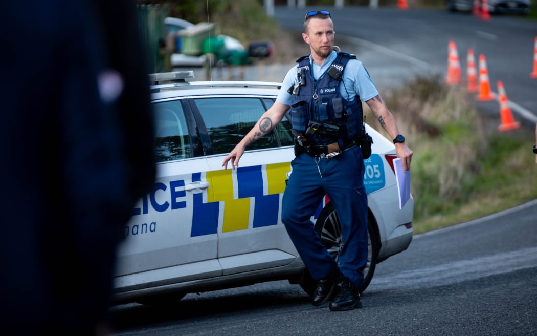 Police at the scene on Te Anga Road, Waikato, where Tom Phillips was fatally shot after he fired at police, critically injuring a constable.