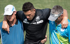 Sonny Bill Williams is helped from the field after damaging his Achilles tendon during New Zealand's loss to Japan.