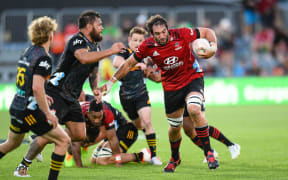 Sam Whitelock of the Crusaders is tackled by Angus Taï¿½avao of the Chiefs during the Super Rugby Aotearoa rugby match, Crusaders V Chiefs, at Orangetheory Stadium, Christchurch, New Zealand, 13th March 2021. Copyright photo: John Davidson / www.photosport.nz