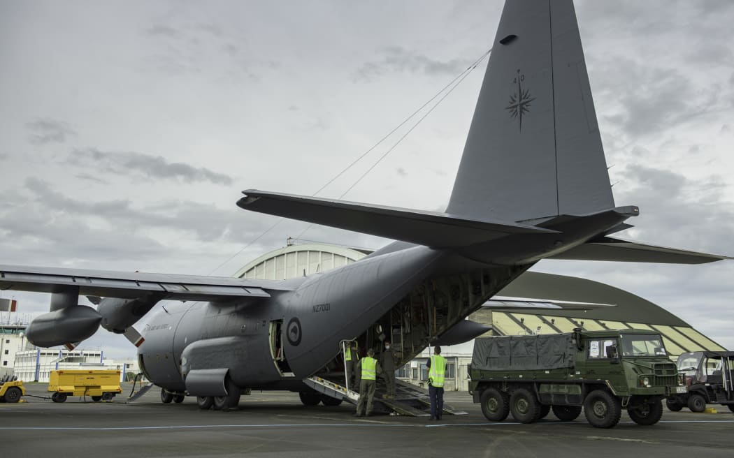 A Royal New Zealand Air Force C-130 Hercules transporting vehicles and other equipment and the Ōhakea base this morning.