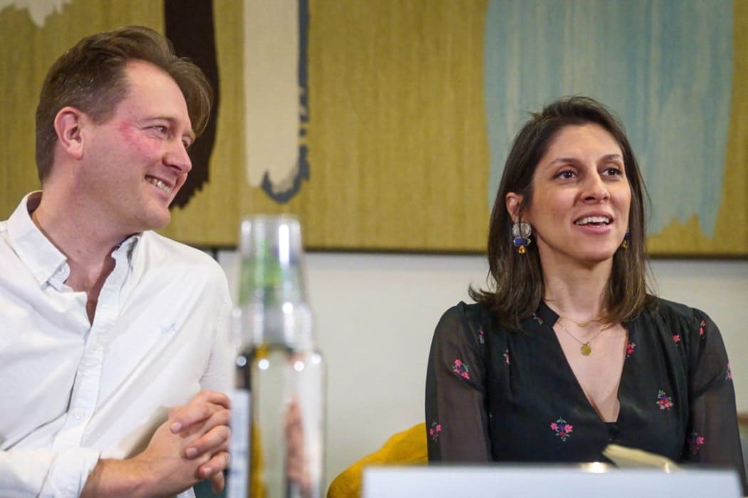 Nazanin Zaghari-Ratcliffe (R), flanked by her husband Richard Ratcliffe (L), speaks during a press conference hosted by MP Tulip Siddiq, in the Macmillan Room, at Portcullis House, in London, on March 21, 2022 following her release from detention in Iran last week.