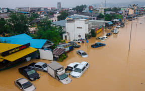 Flood waters submerging vehicles in Hat Yai in Thailand's southern Songkhla province, as severe flooding affected thousands of people in the country's south following days of heavy rain.