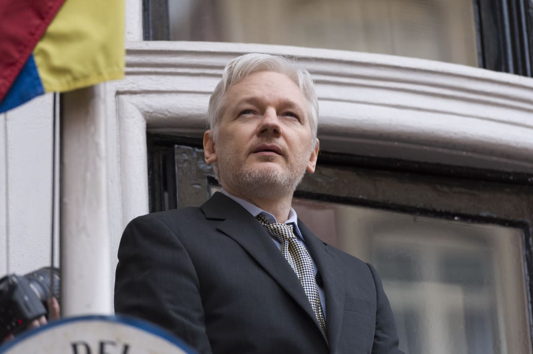 Julian Assange addresses media from the balcony of the Ecuadorian Embassy in London earlier this year