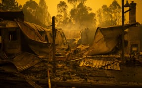 The remains of burnt out buildings are seen along main street in the New South Wales town of Cobargo on December 31, 2019, after bushfires ravaged the town.