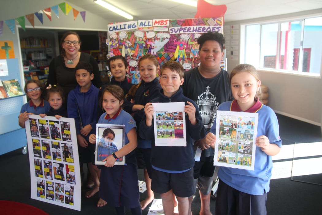 Mangere Bridge School students with the comic.