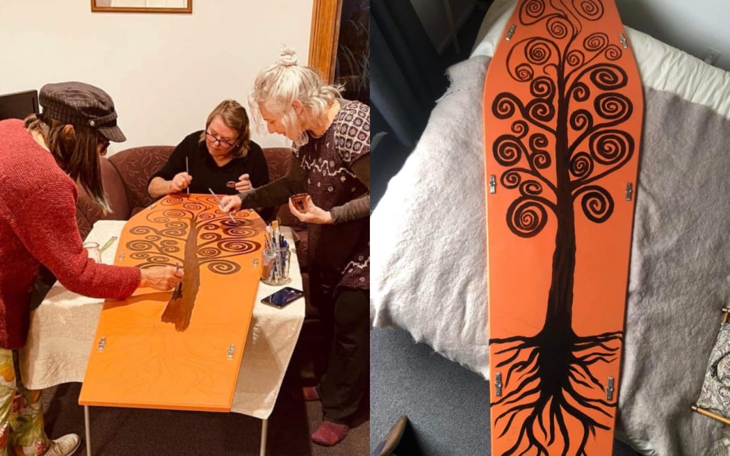 Cora Torr painting her coffin with friends and family.