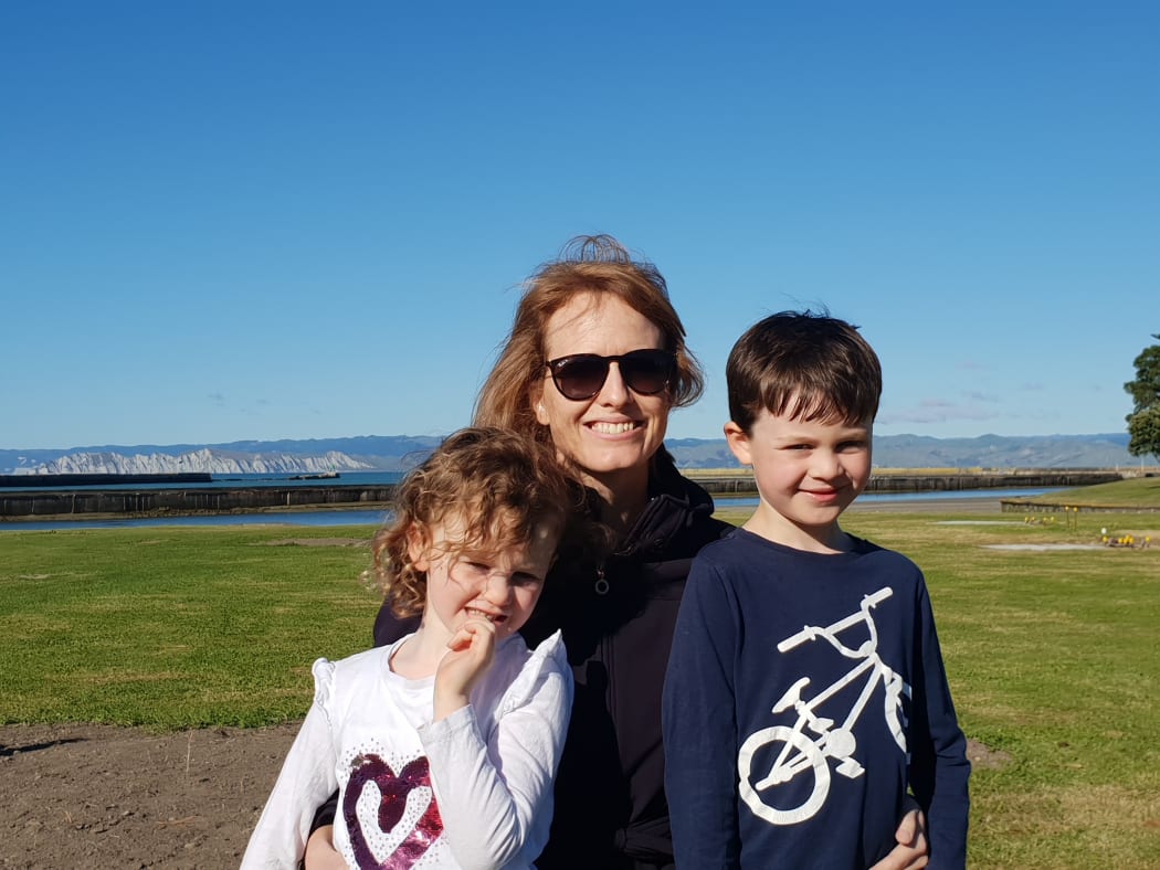 Sarah Guinness and her two children getting ready to watch the tall ships come in.