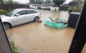 Flooding in Swanson, Auckland, from the Waimoko stream.