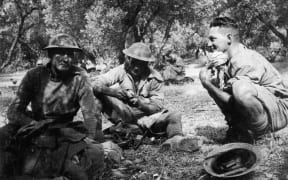 Soldiers shelter amongst olive trees on Crete
