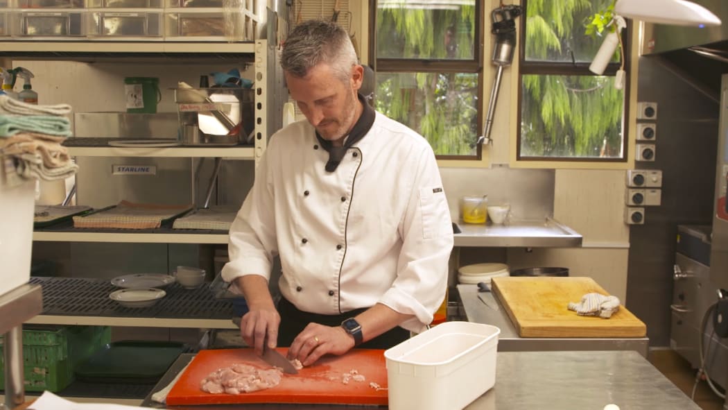 Head chef Hamish Blair hard at work in Larnach Castle's kitchen.