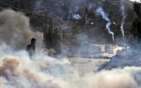 Palestinian demonstrators clash with Israeli soldiers in the West Bank yesterday as violence across the occupied territories simmers.