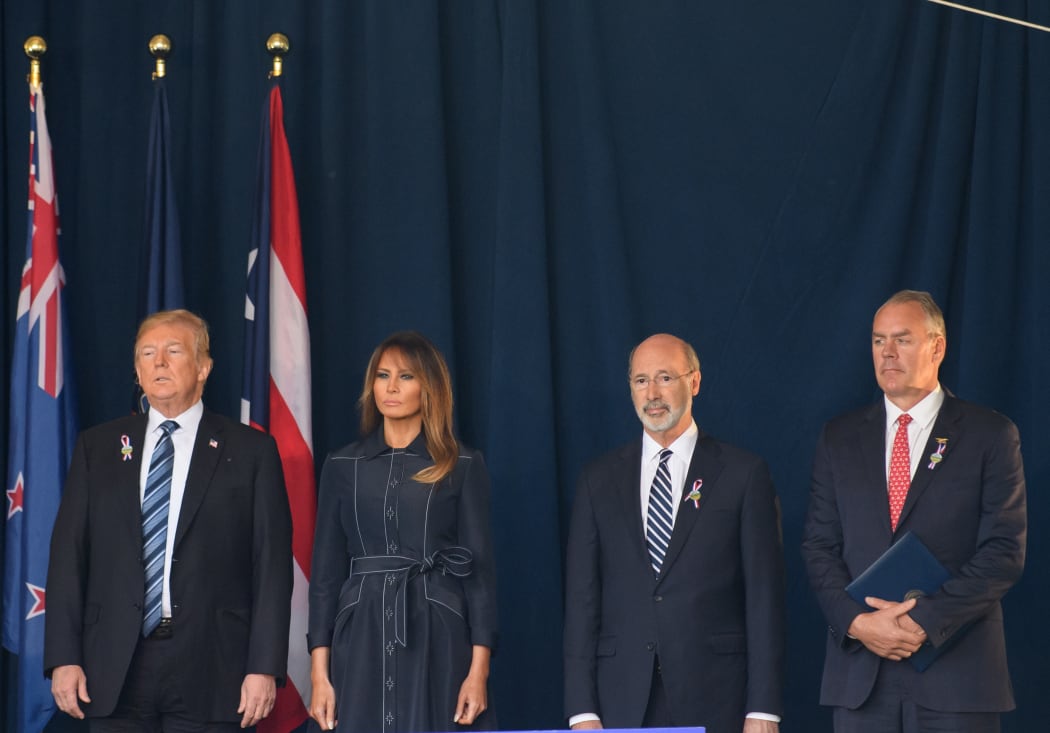 President Donald J. Trump waits with his wife, Melania, Pennsylvania Governor Tom Wolfe, and Interior Secretary Ryan Zinke before delivering a speech at the Flight 93 National Memorial commemorating the 17th Anniversary of the crash of Flight 93.