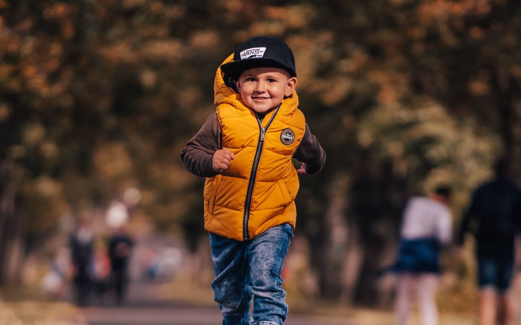 young boy running