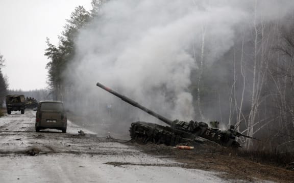 Smoke rises from a Russian tank destroyed by Ukrainian forces in Lugansk region on February 26, 2022.