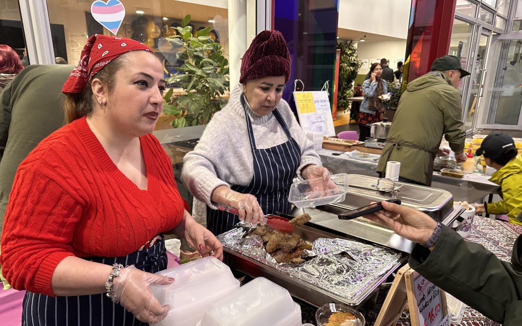 Mandy Asadpour serves Iranian food at the Sepahan Kitchen stall.