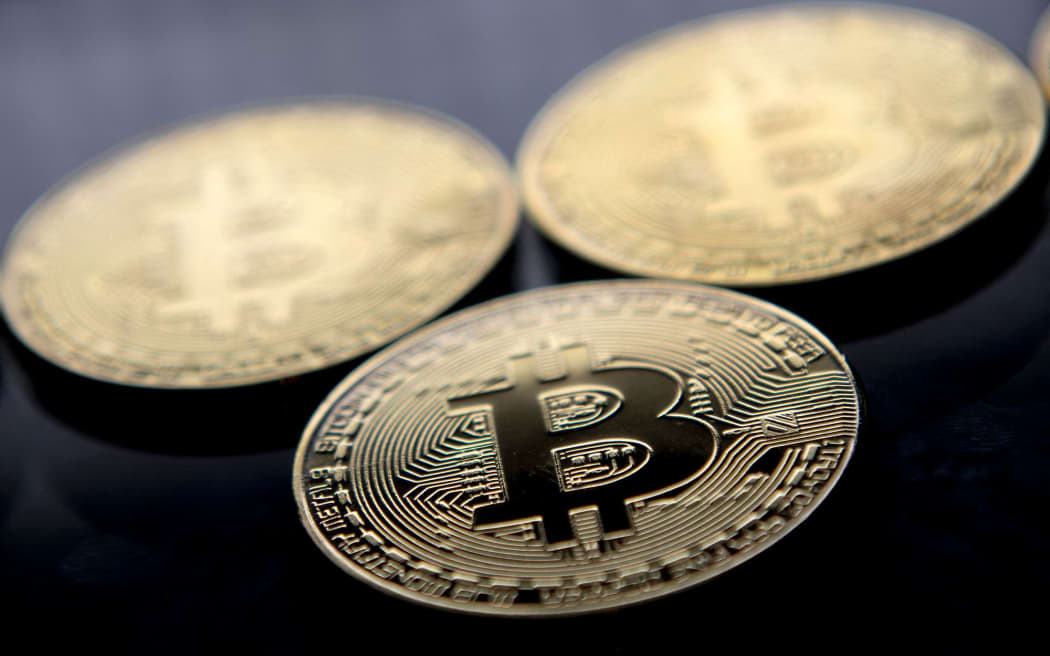 Gold-plated souvenir Bitcoin coins are arranged for a photograph in London in November 2017.