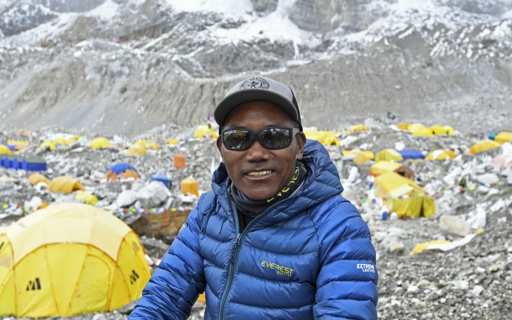 (FILES) In this file photo taken on May 2, 2021, Nepal's mountaineer Kami Rita Sherpa poses for a picture during an interview with AFP at the Everest base camp in the Mount Everest region of Solukhumbu district. Kami Rita Sherpa reached the top of Mount Everest for the 27th time on May 17, reclaiming the record for the most summits of the world's highest mountain.