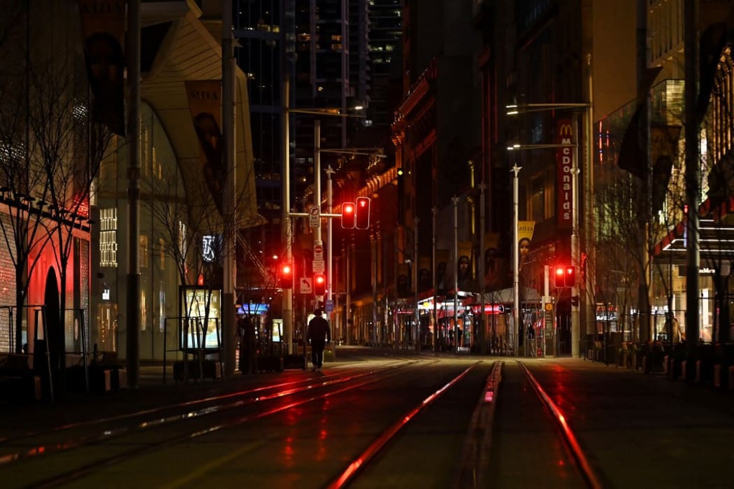 A quiet George Street promenade is pictured on a usually busy evening in Sydney on July 17, 2021, after authorities ordered new restrictions as a weeks-long lockdown failed to quash an outbreak of the Covid-19 coronavirus.