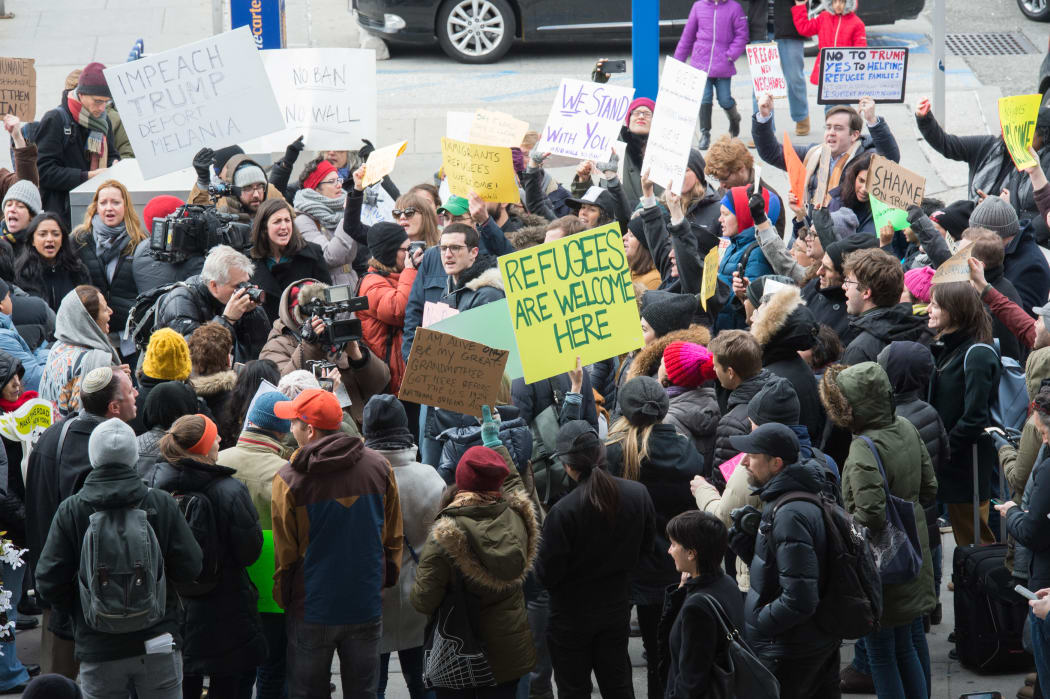 Protesters gather at JFK International Airport's to demonstrate against Donald Trump's executive order.