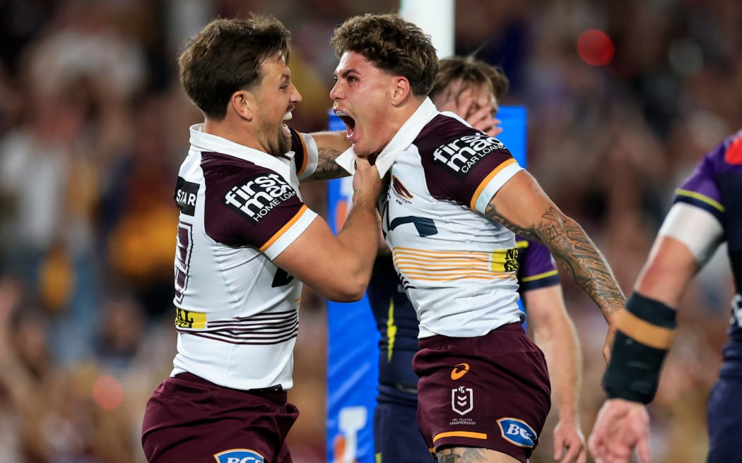 Reece Walsh of the Broncos celebrates scoring a try with team mates during the NRL Grand Final match between the Brisbane Broncos and the Melbourne Storm at Accor Stadium in Sydney, Sunday, October 5, 2025. (AAP Image/Mark Evans/ Photosport)
