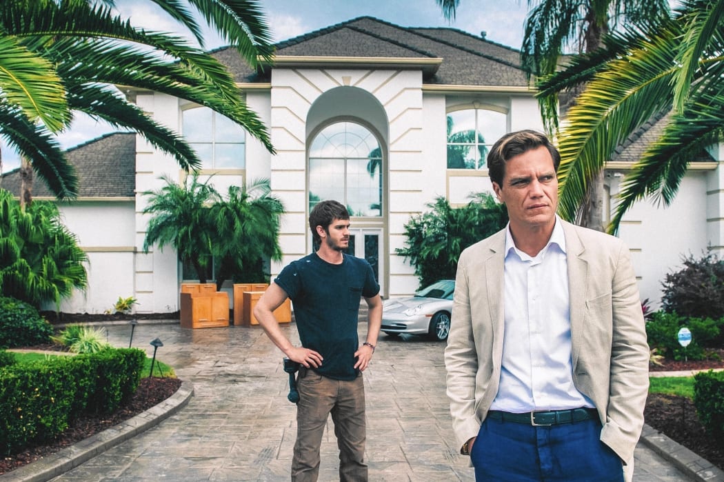 Andrew Garfield (Nash) and Michael Shannon (Carver) in Ramin Bahrani’s 99 Homes