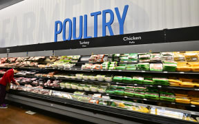 A shopper browses near the poultry section at a Walmart in Rosemead, California on December 19, 2024. - An elderly patient in Louisiana is in "critical condition" with severe avian influenza, US authorities announced December 18, 2024, the first serious human case in the country as fears grow of a possible bird flu pandemic. Genetic sequencing revealed that the H5N1 virus in the patient belonged to the D1.1 genotype.  This genotype has recently been detected in wild birds and poultry in the United States, and in human cases reported in Washington state and in the Canadian case, in British Columbia province (Photo by Frederic J. BROWN / AFP)